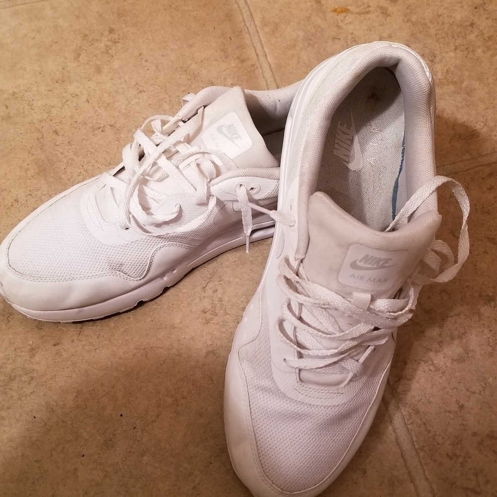 All white Nike Air Max.